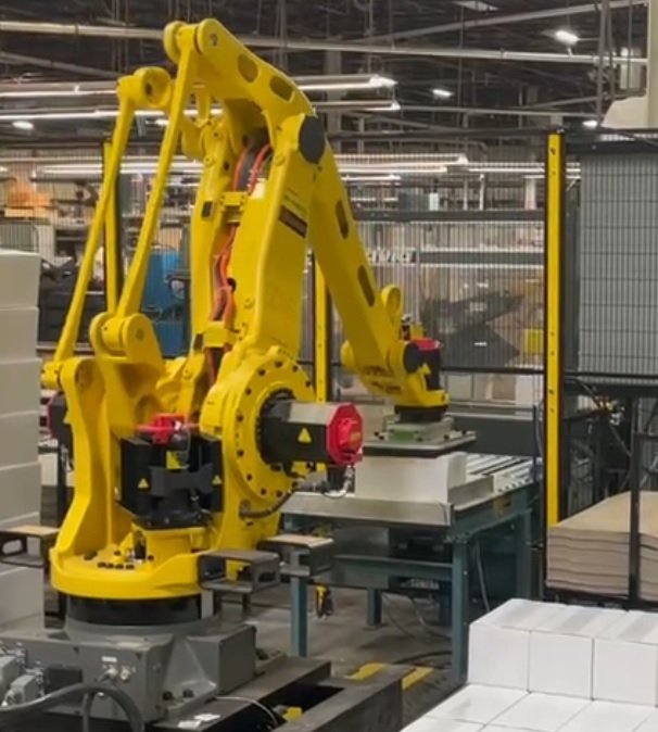 FANUC robot integrated into an automated manufacturing system